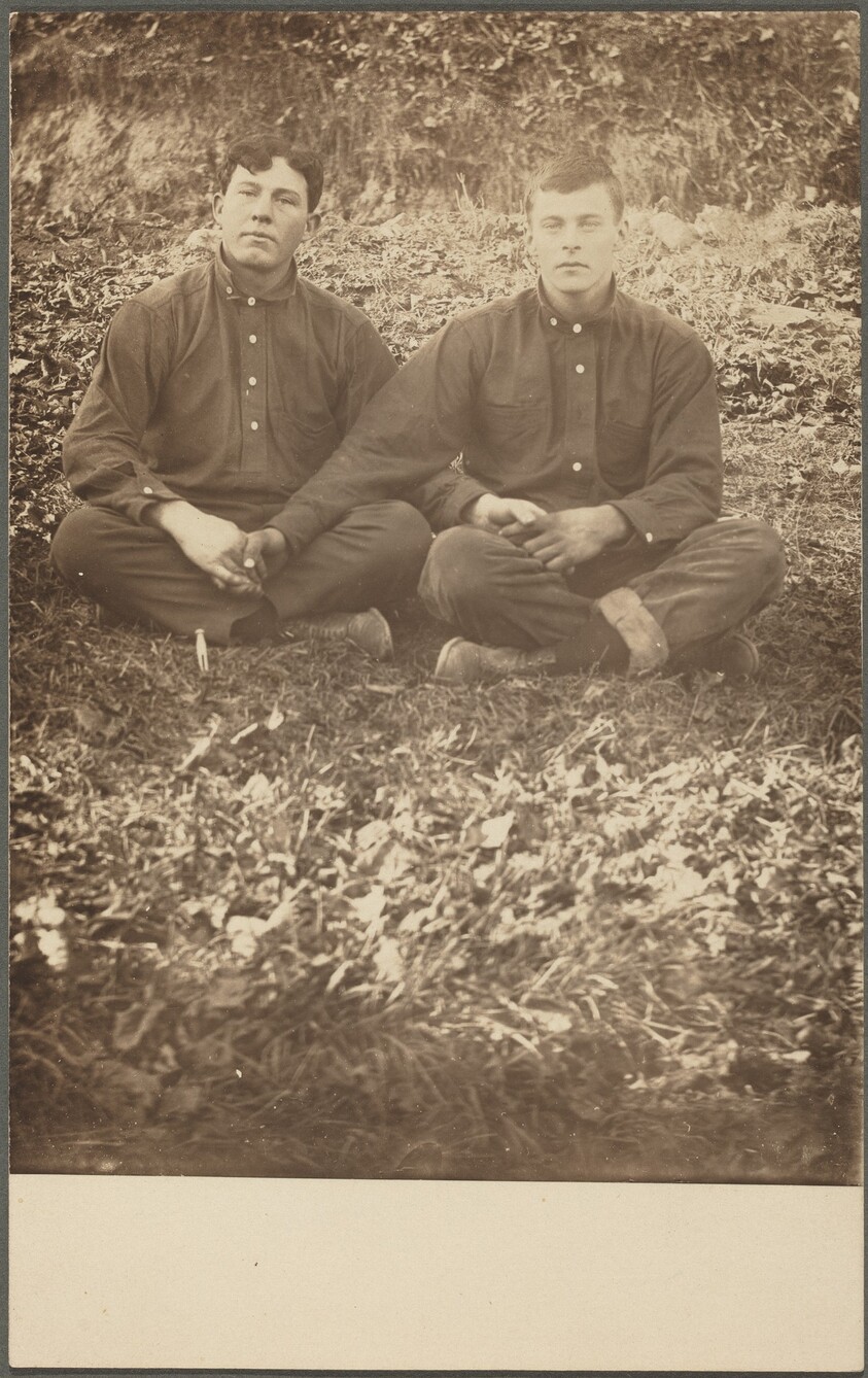 Untitled (Seated men holding hands)