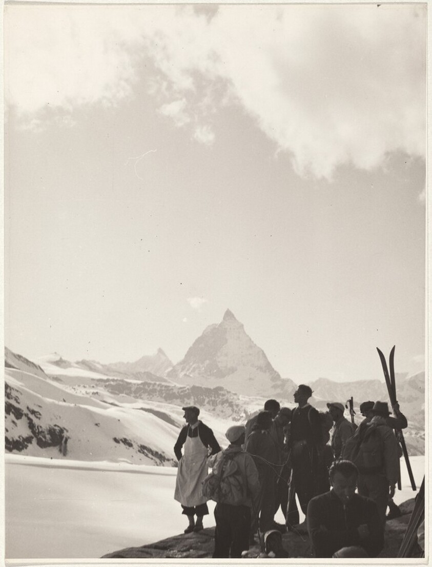 Skiers looking at distant mountains--Sports