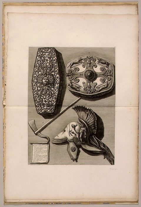 The image displays four ancient objects: two shields with elaborate designs, a helmet with a crest and decorative figure, and an axe-like weapon with a long handle. The color scheme is primarily grayscale, emphasizing the textures and details. The shields are at the top, with an elongated shield on the left and a rounded shield on the right. Below them, the helmet is situated on the right side, showcasing its design. The axe-like weapon crosses diagonally beneath the shields, and beneath it is a piece of paper with text on it leaning against the handle.