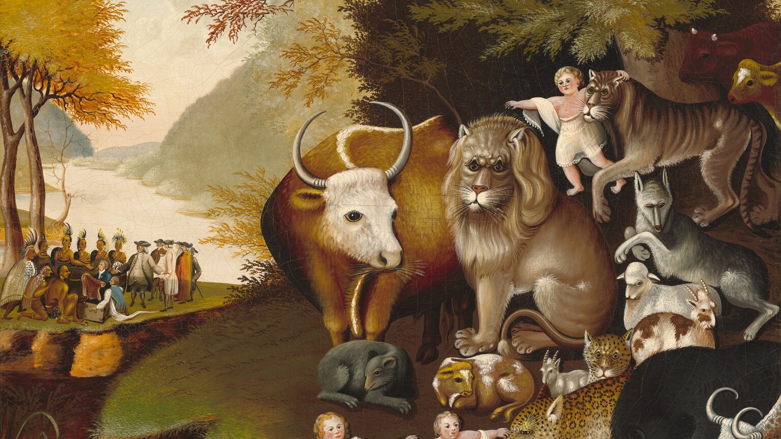 Three small children with pale pink skin sit and stand among a group of animals to our right as a group of eight indigenous people with light brown skin gather with eight white-skinned men near a riverbank in the distance to our left in this horizontal painting. The children and animals take up the right two-thirds of the composition. They gather on a flat-topped spit of land, which is covered in grass. All three children have blond hair and rounded features. Two sit on the ground at the bottom center of the painting. The largest animal is a caramel-brown bull, which stands next to a pale golden lion. The other animals are smaller in scale, and include a tiger, wolf, sheep, goats, cows, bears, and a jaguar, all sitting or standing at rest around the bull and lion. At the top center of the group of animals, one child stands over the lion’s back and has one arm around the tiger’s shoulders, and another child at the lower center touches the jaguar’s nose. A tree with olive-green, rust-red, and harvest-yellow leaves grows up the right edge of the canvas, in front of a tall, forest-green bush. On another spit of flat-topped, elevated grassy land to our left, six of the indigenous people stand in a row, wearing feathered headdresses. Two more kneel in front, creating a U-shape. The two in front wear loin cloths, and all eight wear gold earrings and necklaces. They face a gathering of eight men wearing tricorn hats, long coats, waistcoats, knee-length britches, and stockings in shades of gray, blue, white, brown, and orange. One of these men hold up a roll of cloth lifted out of a chest. Trees with spindly trunks and golden yellow canopies reach into the top corner of the painting along the left edge. The river extends into the distance beyond this group, with pale, sage-green hills carpeted in trees. Puffy white clouds float across a sky that deepens from pale shell pink along the horizon to light blue along the top. The features of the animals and children are painted simply and appear rather flat, giving them an almost cartoonish look.