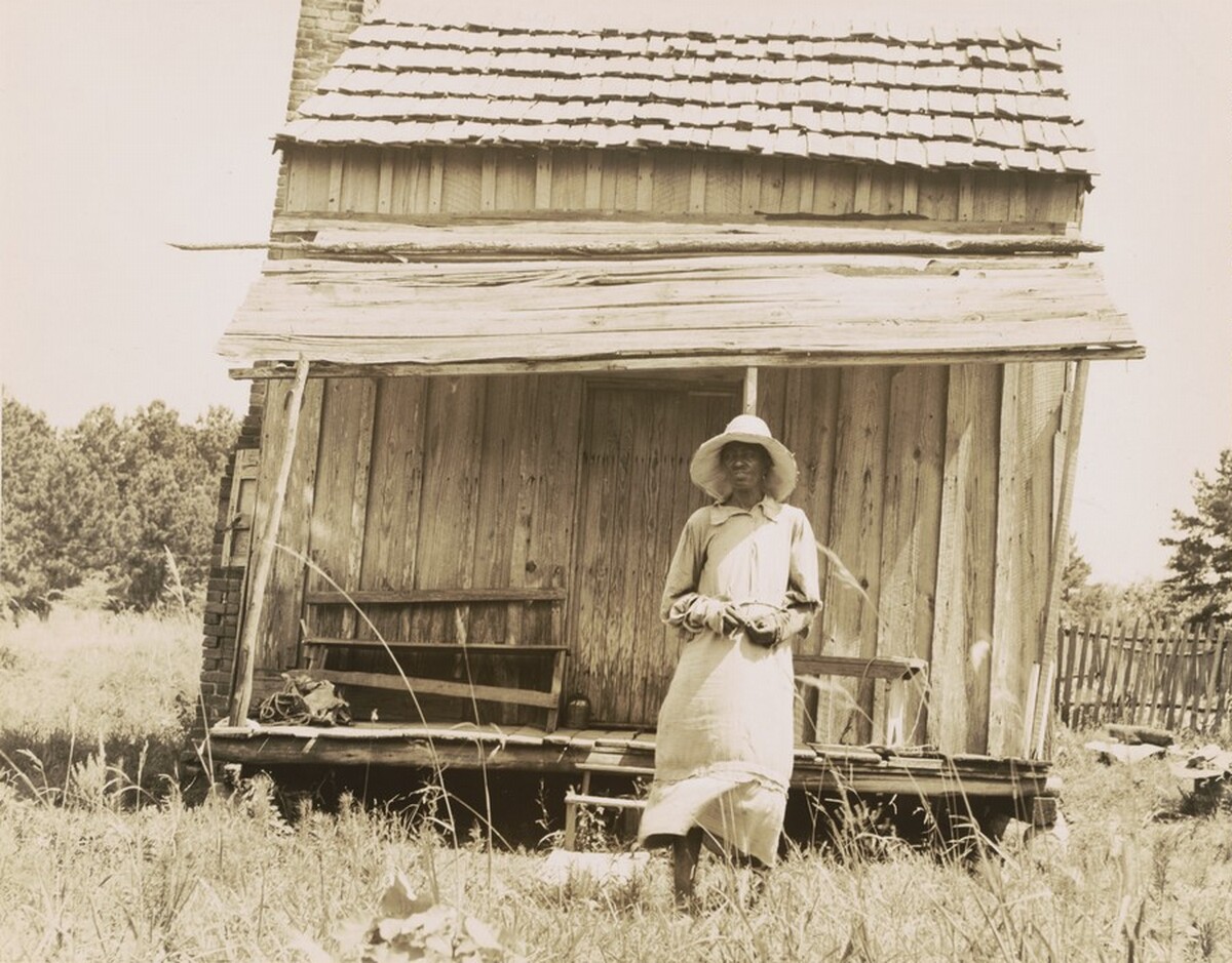 Sharecropper's cabin and sharecropper's wife, 10 miles south of Jackson, Mississippi