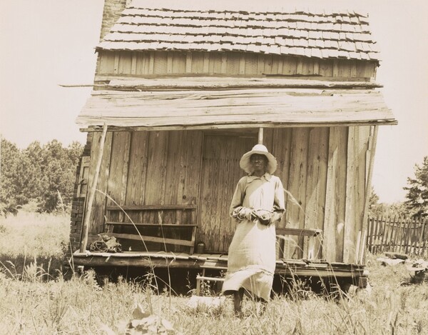 Sharecropper's cabin and sharecropper's wife, 10 miles south of Jackson, Mississippi