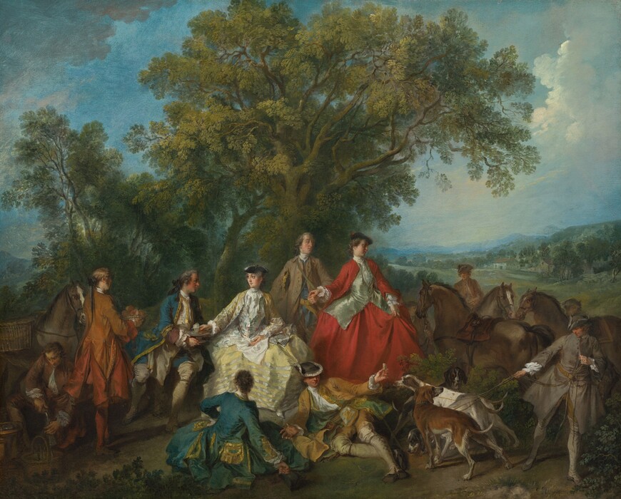 Seven elegantly dressed men and women sit and stand together in a landscape while being attended to by more men, who also tend to four dogs and four horses, in this horizontal painting. The people all have pale skin with flushed cheeks and delicate features. They gather in front of a grove of towering trees, the canopies of which reach the top edge of the painting and fill much of the sky in the top half of the composition. In front of the trees, one woman sits and one stands at the center of the painting. To our left of center, the seated woman wears a muted, lemon-yellow dress trimmed with white. The bodice has a high neck and a narrow waist, and her outer yellow jacket is unbuttoned. She wears a small black tricorn hat perched on gray curls. She sits with her body facing us, but she turns to look at a man to our left with big eyes. She reaches out with one hand to take a teacup topped with froth from a tray that man holds. He sits and leans his torso toward the woman, looking at her in profile. His coat is sapphire blue edged with gold. His and the other men’s hair curl around their ears and are tied at the nape of their necks with black ribbons. The other woman stands next to the first, to our right. Her hoop skirt and jacket are scarlet red over a shimmering, ice-blue bodice. Her body angles to our right, and she looks off in that direction in profile. Her brown hair is pulled up under a black cap topped with a red feather. She holds her skirts with her left hand, to our right. A man standing slightly behind her and to our left holds out a loose fist, and she rests her other hand on his. This man wears a fawn-brown coat over an ultramarine-blue waistcoat. He pins a black, gold-edged hat under one arm and looks at the back of the woman’s head. Two more people sit on the ground in front of these couples. A person to our left sitting facing away from us has brown hair and wears a blue jacket. One hand is planted on the hip and the other holds a black hat by the ground. The other is a man who faces us as he leans on one elbow. He wears a dark yellow jacket, and a black hat hides his eyes. He holds out a piece of food to the four dogs in the lower right corner of the painting. One dog strains forward to smell it. Another sniffs the ground, one looks at us, and the fourth looks back at the man holding the dogs’ leashes. Three men tend to three brown horses just beyond this. To our left, a man wearing burnt orange holds a bowl of peach-colored fruit near the left-most couple. A man behind him kneels and pours liquid from a pouch into a decanter. Two baskets are on the ground next to that man and another basket is slung over the back of a gray horse behind him. Grass and leafy vegetation grows to either side of the grouping. Green hills roll back to distant, hazy blue mountains along the horizon, which comes halfway up this composition. Puffy white and gray clouds swirl in the powder-blue sky above.
