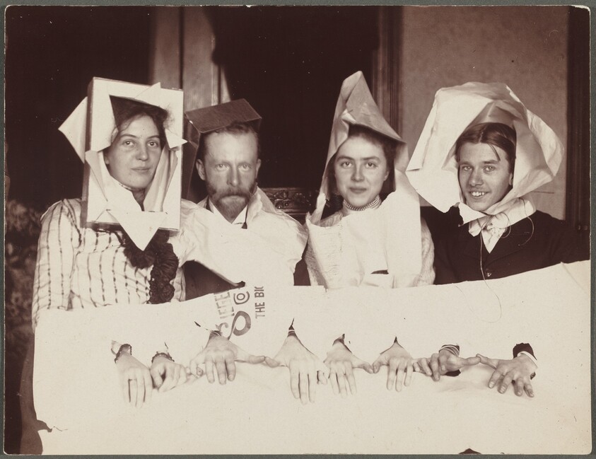 Untitled (Four men and women in paper costumes)