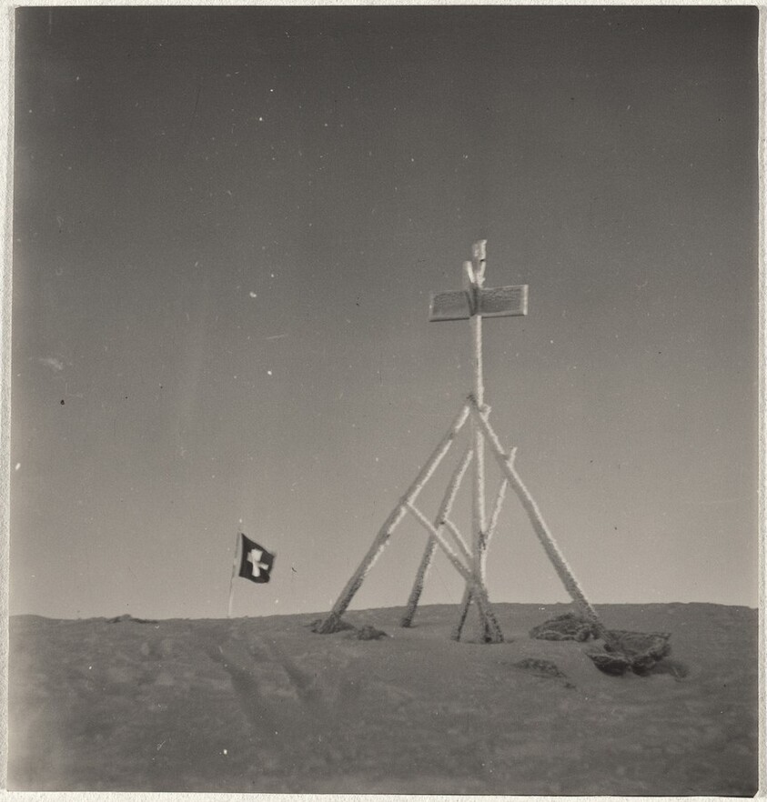 Swiss flag on mountain peak, Arosa