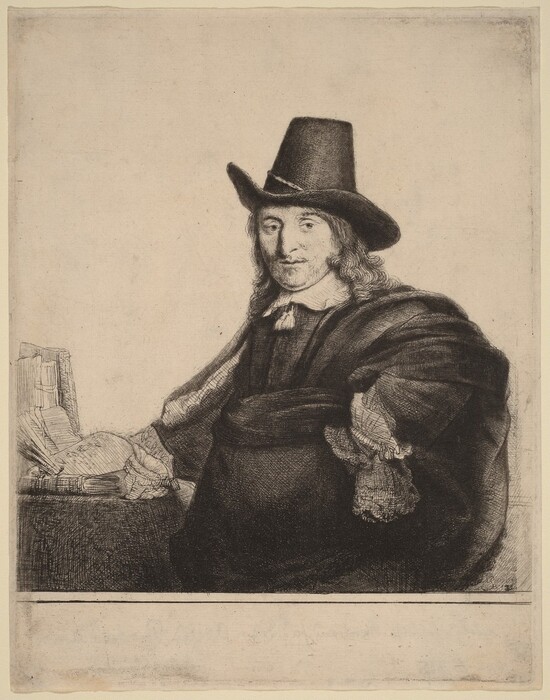 The image shows an upper body portrait of a seated man turned slightly to the side, but facing forward. He has long, curly hair that falls past his shoulders and a slight mustache, with defined facial features visible in the etching. He is wearing a wide-brimmed hat and a dark cloak over a tunic that features a white collar with lace cuffs. His right hand rests on a book that is part of a small stack placed on a table in front of him, which includes a few other books and papers. The background is plain.