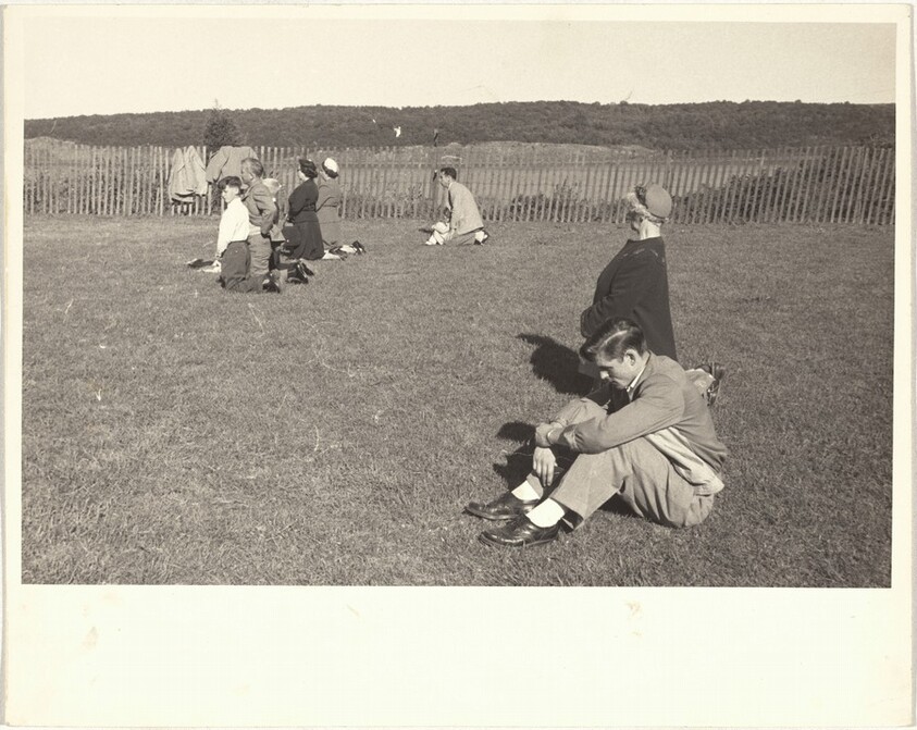 Group kneeling in field--J.L.A.