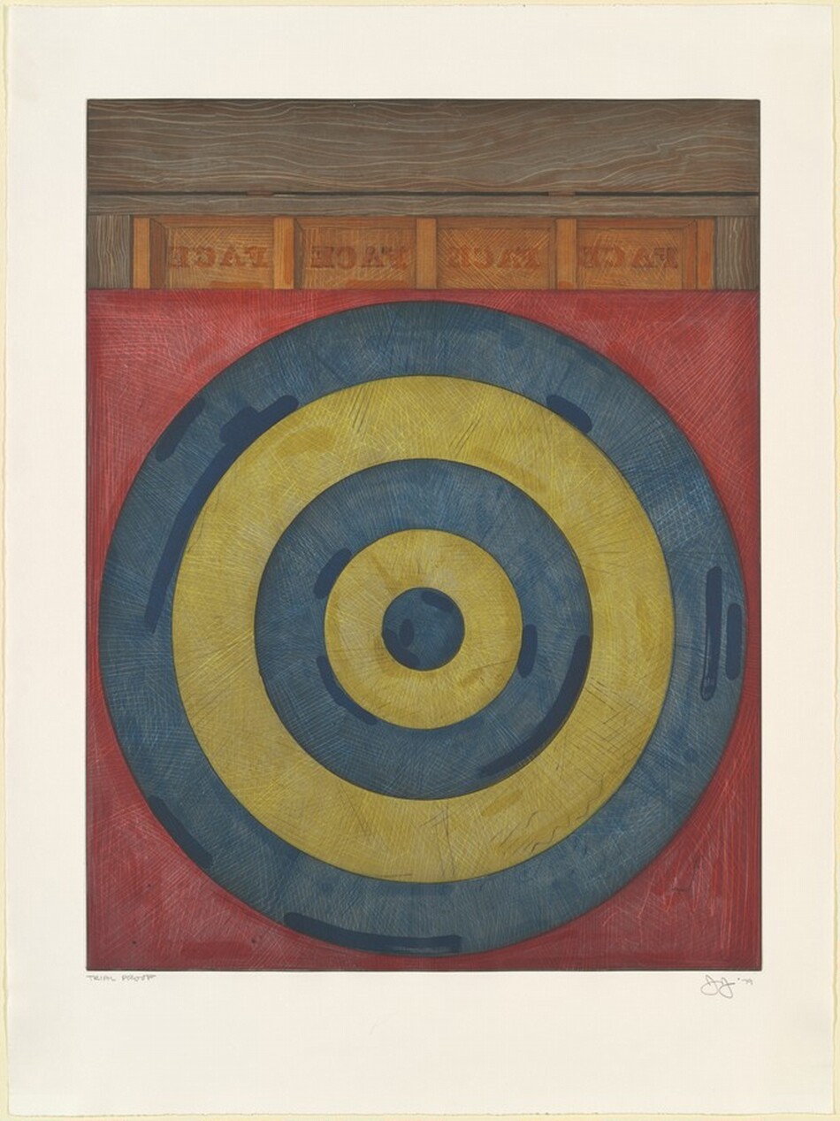 Concentric grayish-blue and muted yellow rings forming a target alternate against a brick-red background in this vertical etching. The innermost circle is blue and is followed by two yellow and two more blue rings. The rings and background are covered with hatch marks, and darker strips of the colors are drawn near the edges of the rings. A row of four burnt-orange blocks, each with the word "FACE" printed backward and in darker orange, lines the target along the top edge. The trim around the blocks and across the top quarter of the etching is painted ash brown and then lined with a lighter tan to suggest wood grain. A slat across the top of the composition is separated from the words below by a thin black line and two brown sections that suggest hinges. The printed image is surrounded by a wide white margin. Pencil inscriptions under the printed image reads “Trial Proof” to the left and "J J '79" to the right.