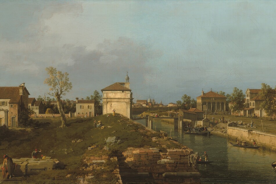 Warm light pours onto white stone and brown brick buildings in a grassy landscape in this horizontal painting. Tiny people walk, stand, sit, and work across the turf, among the buildings, and over a bridge spanning a canal to our right. The people wear long-sleeved shirts, vests, britches, stockings, dresses, hats, and caps in shades of straw yellow, olive green, apple red, muted blue, brown, and bright white. Touches of peach paint suggest they are all pale skinned. The people closest to us are three men working along what might be the remains of a stone foundation in the lower left corner. One raises an instrument while another crouches nearby on the far side of the structure, and the third leans on our side, looking down at the grass. The land rises gently back to the end of a row of structures to our left. A thick-trunked tree with a sparse canopy is halfway between those structures and a building on our side of the bridge, in the center of the composition. That bone-white structure has engaged columns with capitals, a tiled roof, and a round, gazebo-like lantern or bell tower. A brick wall between more buildings line a lane beyond the tree and these structures, and rooflines pile up along the horizon, which comes halfway up the composition. People and children stand and sit on the grassy knoll or walk along the lane. The canal angles from the lower right corner of the canvas to the center of the horizon. The walls of the canal are built with thin layers of peach and tan-colored stone. Close to us, the wall on our side jogs to our left, creating an inlet or bay. A staircase cuts into the far wall to allow access to the water. Boats steered by men using long sticks carry people or supplies. A more elaborate covered boat, likely a ferry, pulls up to the base of the stairs. The stairs lead up to a plaza, which is lined with peanut-brown buildings with terracotta-brown roofs. People and dogs mill about the square and cross the bridge beyond the ferry. Some smoky-purple clouds drift into the scene from the left against an otherwise clear blue sky.