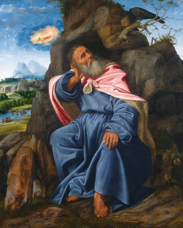 Close to us, a bearded man with pale, peachy skin sits against a tall, narrow rock formation against a deep landscape in this vertical painting. The man has gray hair, deep-set eyes, high cheekbones, and his lips are downturned in his long beard. He sits with his knees and body angled to our left, but he turns to look up and to our right at a raven perched on the stone. His right elbow, to our left, is propped on a rocky ledge, and his head rests in that hand. His other veined, large hand rests on his knee. He wears a voluminous, long-sleeved, aquamarine-blue robe under a cloth tied around his neck. The cloth is rose-pink on the outside and appears to be lined with fleece on the underside. Near the top right corner of the composition, the raven leans toward the man holding a roll in its beak. The man’s bare feet rest on the dirt ground, and a couple of scrubby plants grow in the lower right corner of the painting, next to the rock on which the man sits. A river cuts through grassy land in the deep distance to the left of the rock formation. Several people gathered near the water’s edge point or look up into the sky, where a man kneeling in a chariot is drawn into a peach-toned cloud bank in the blue sky. Steep mountains on the horizon are icy blue.