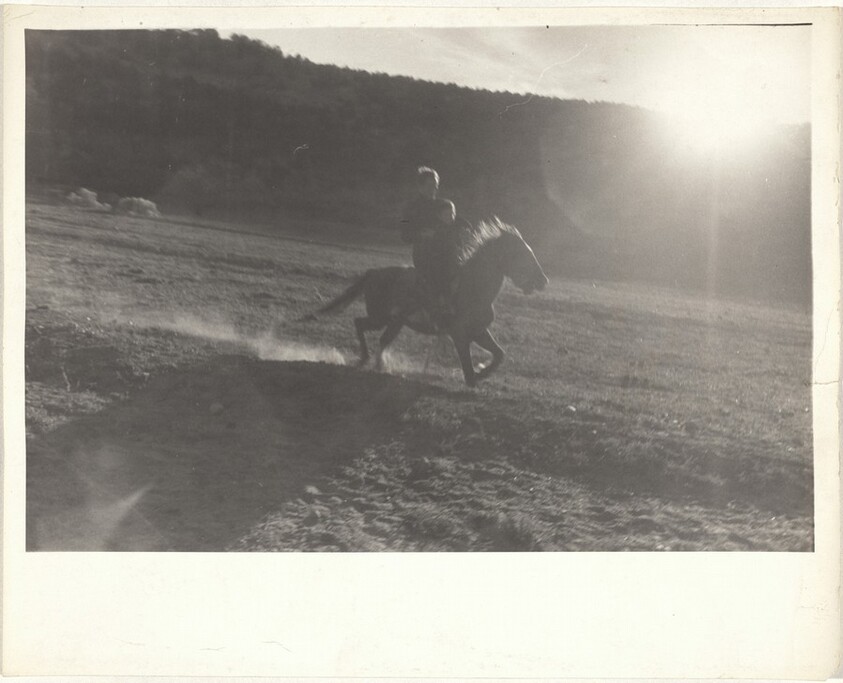 Man and child on horse--New Mexico