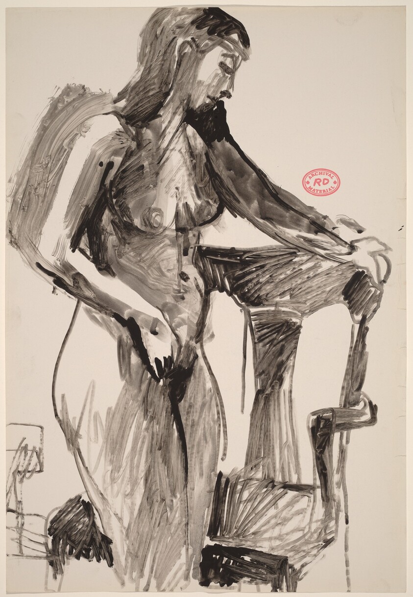 Untitled [standing nude holding a chair back with her left hand]