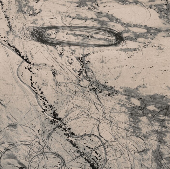 The image displays a network of swirling lines and circular shapes creating an abstract pattern. The loops and curves intersect and overlap, conveying a sense of energy and motion. Darker areas contrast with the overall design. The composition suggests a dynamic map of invisible pathways.