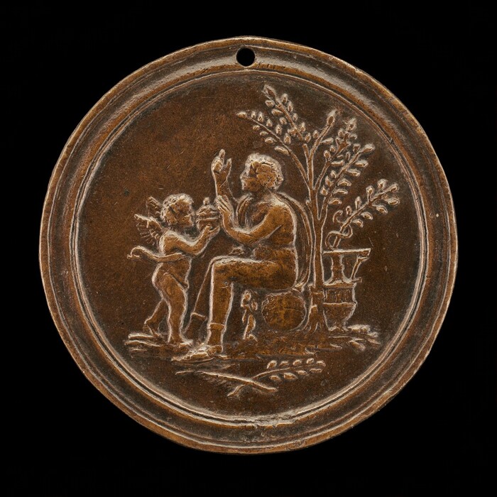 The sculpture is a roundel featuring the engraved relief of a seated older man with curly hair, draped in fabric, gently interacting with a cherubic figure. The cherub, depicted with wings, stands in front of the man extending its hands towards him. Behind them is a tree with detailed foliage growing beside a large urn-like container, adding depth to the scene. The material of the roundel appears to be a dark bronze or copper with a patina. The roundel displays an intimate and serene scene crafted with attention to detailing and realism in the figures' postures and expressions.
