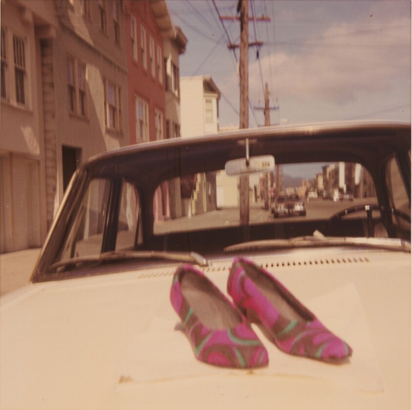 Untitled (Pair of shoes on car)