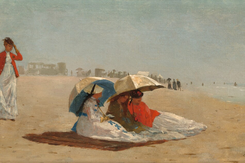 Four women with pale, peach skin, wearing long white dresses, stand or sit on a sunny beach in this wide, horizontal painting. People and carriages are painted as hazy gray silhouettes spread along the beach in the distance. The silhouettes span the left half of the horizon, which comes halfway up the painting. To our right, the water is a pale blue with loose strokes of white, light gray, and ice blue to suggest waves and surf. On the pale sand, three of the women sit close to us, huddled under two broad parasols on a brown blanket. Their bodies face the water, and their features and clothing are loosely painted. The woman closest to us has a white dress with lapis-blue bows down the front and a blue sash tied at her back. Her flat, round, straw-yellow hat is tied onto her head with a black bow. She wears a yellow glove on the hand we can see, and she props one parasol over her far shoulder. The inside of the parasol is bright blue, the outside cream white. The other two women sit together under the second parasol, also cream colored. In the center of the trio, the woman wears an olive-green shawl or wrap, and her reddish-brown hair might be loose over her shoulders. The third seated woman wears a bright red wrap and a dark hat. A bit behind these women, a fourth stands looking toward them or the water. She also wears a long white dress under a vivid red jacket and a small brown cap. She holds her skirt with one hand and touches her hat with another gloved hand. Another loosely painted form farther back along the beach appears to be a woman wearing black and holding a white parasol. The artist signed and dated the painting with the location in the bottom right corner: “W. H. 1874 East Hampton L. I.”