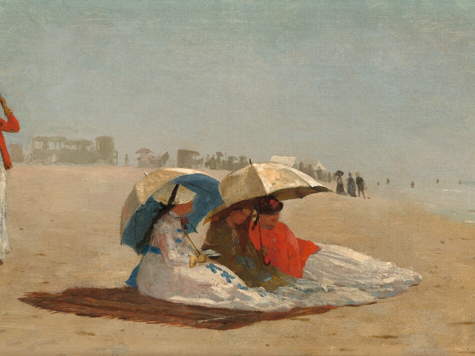 Four women with pale, peach skin, wearing long white dresses, stand or sit on a sunny beach in this wide, horizontal painting. People and carriages are painted as hazy gray silhouettes spread along the beach in the distance. The silhouettes span the left half of the horizon, which comes halfway up the painting. To our right, the water is a pale blue with loose strokes of white, light gray, and ice blue to suggest waves and surf. On the pale sand, three of the women sit close to us, huddled under two broad parasols on a brown blanket. Their bodies face the water, and their features and clothing are loosely painted. The woman closest to us has a white dress with lapis-blue bows down the front and a blue sash tied at her back. Her flat, round, straw-yellow hat is tied onto her head with a black bow. She wears a yellow glove on the hand we can see, and she props one parasol over her far shoulder. The inside of the parasol is bright blue, the outside cream white. The other two women sit together under the second parasol, also cream colored. In the center of the trio, the woman wears an olive-green shawl or wrap, and her reddish-brown hair might be loose over her shoulders. The third seated woman wears a bright red wrap and a dark hat. A bit behind these women, a fourth stands looking toward them or the water. She also wears a long white dress under a vivid red jacket and a small brown cap. She holds her skirt with one hand and touches her hat with another gloved hand. Another loosely painted form farther back along the beach appears to be a woman wearing black and holding a white parasol. The artist signed and dated the painting with the location in the bottom right corner: “W. H. 1874 East Hampton L. I.”