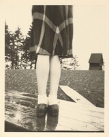 Untitled (Plaid skirt and legs on wood table), American 20th Century, 1940s