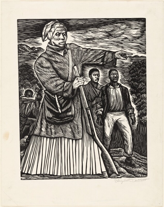 Printed with black against cream-white paper, a woman pointing to our right nearly fills this vertical linocut. Her body is angled slightly to our right, and she looks off in that direction with hooded eyes. She has wide cheekbones, a thin upper lip, full lower lip, and her mouth is closed over a pointed chin. Her head is covered in a patterned cloth, and she wears a knee-length coat over a long skirt. A knapsack hangs across her torso, and she braces the barrel of a rifle with her right hand, to our left, as she points with the other hand. Two people with short, dark hair stand behind her and to our right. The front person wears pants, square-toed shoes, and a jacket over a shirt. Bracelet-like objects on his wrists could be broken shackles. The other person touches that man’s arm. A fourth person digs in the background to the left. The ground, trees, hills, and sky are dense flicks, slivers, and strokes. The artist signed the sheet in the bottom right corner under the image, “Elizabeth Catlett.”