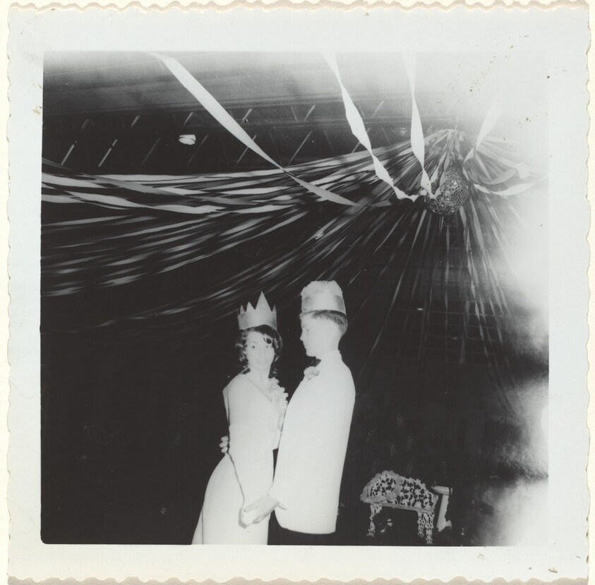 Untitled (Adolescent couple wearing paper crowns at a dance)