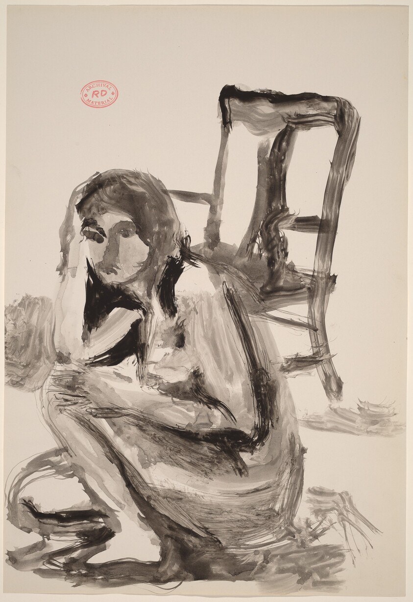 Untitled [female nude crouching in front of a chair]