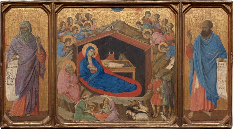 This horizontal painting is made up of three parts: in the center square panel, a woman reclines under a wooden shelter set into a rocky cave, which is surrounded by angels, and narrower wings to either side are each occupied by a standing man. All the people have pale skin, which is tinged with faint green. The three panels are joined with a gold frame, and the gold background behind the central scene and the men in the side panels are covered with a noticeable network of cracks. In the central panel, a cobalt-blue robe nearly envelopes the reclining woman’s body; this is Mary. It covers her head and falls open where she crosses her wrists over her chest to show a pink garment underneath. A flat gold halo encircles her head ,and her body is surrounded by a field of crimson red, almost like an aura. She rests under a wooden structure with a pitched roof, which is surrounded by craggy, barren rock. A swaddled infant lies in a rectangular, tray-like manger. The infant’s head is also surrounded by a gold halo. Fine gold rays emanate down into the structure from a star just above the peak of the roof. A bull and a donkey look down at the baby from the far side of the manger. The interior of the structure behind them is black. In a smaller scale, two women wash a haloed infant in a tub in front of the rocky cave near the lower left corner of this panel. A man with a white beard and hair sits to our left of Mary, holding a pink cloak at his throat and looking toward the infant. Above and around the rocks, seven winged and haloed angels cluster on each side. One angel to the right presents a scroll with black writing to two men accompanied by a dog and several sheep in the lower right. The man in the panel to the left, Isaiah, has a gray beard and long, wavy hair, and he wears a lilac-purple cloak draped over a coral-orange robe. In his right hand, on our left, he holds an unfurled scroll with large black lettering. His other hand is raised with one finger pointing upward. He looks to our left, away from the central scene. On the right, Ezekiel, echoes Isaiah's pose. Ezekiel holds an open scroll with his left hand, on our right, and his other hand is raised. He also wears a coral-colored robe, but his is overlaid with a blue cloak. His receding hair is short and brown, as is his beard. Like Isaiah, he takes up most of the height of the panel and gazes to our left, toward the central panel.