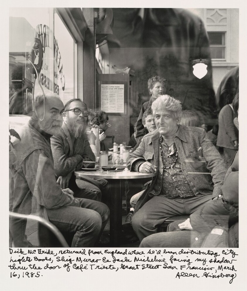 Dick McBride, returned from England where he'd been distributing City Lights Books, Shig Murao & Jack Micheline facing my shadow through the door of Cafe Trieste, Grant Street San Francisco, March 16, 1985.