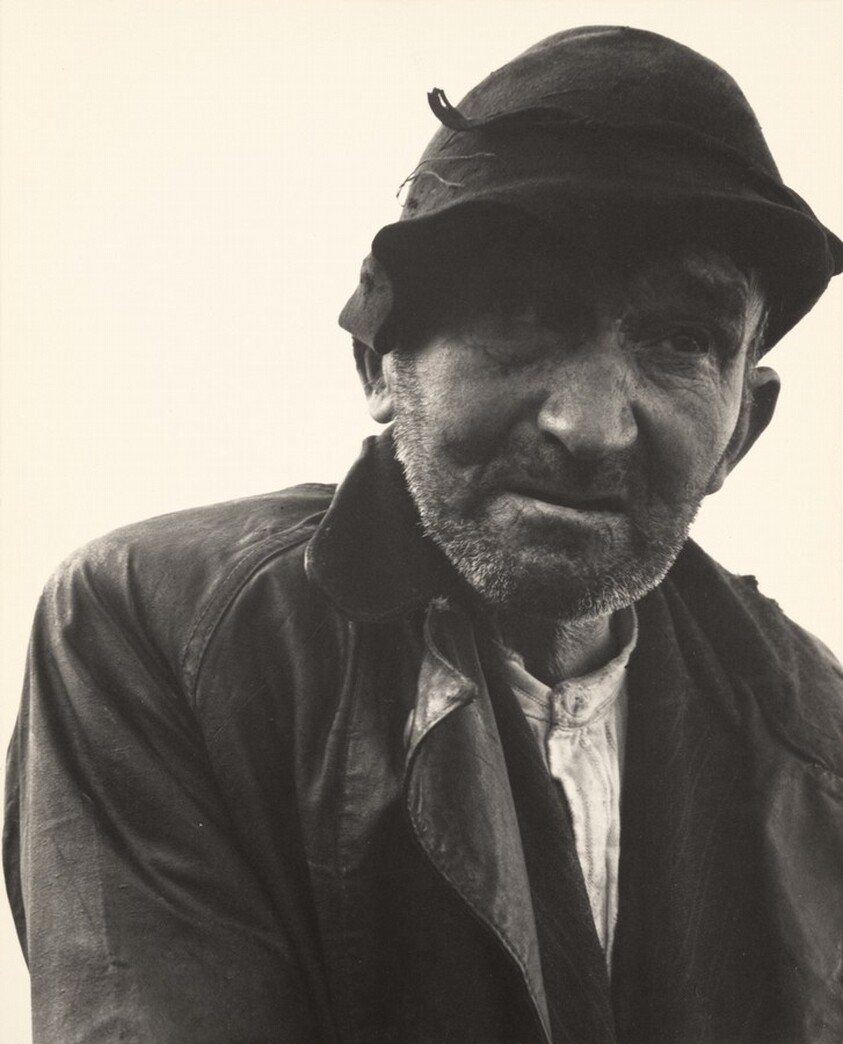 Man walking down a country road from the Kenneally family farm, County Clare, Ireland
