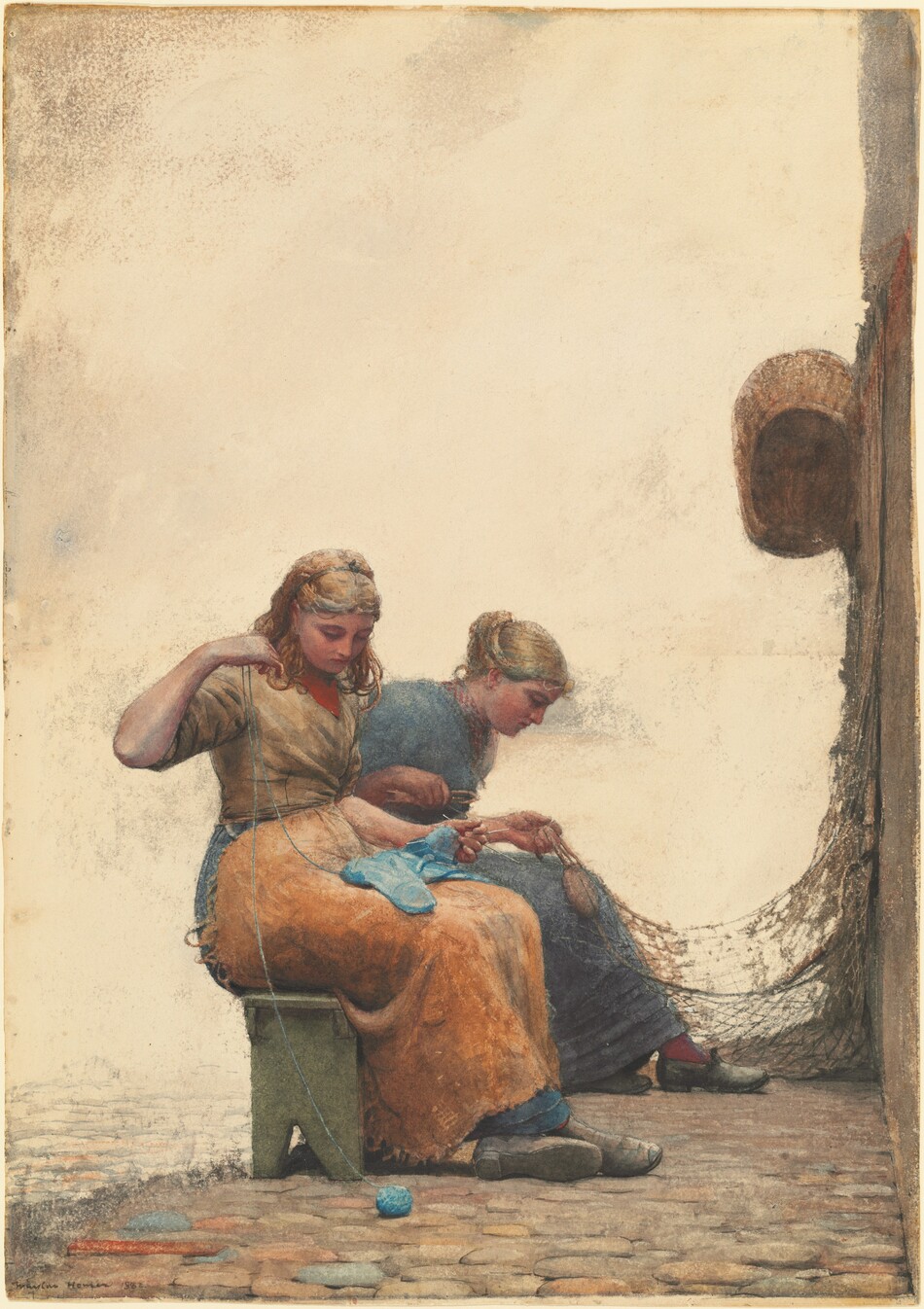 Two pale-skinned young women sit side-by-side on a bench so both face our right in profile as one knits and one mends a fishing net in this vertical watercolor. Both have pale skin with flushed cheeks and long blond hair. They wear long skirts, clog-like shoes, and the bodices have elbow-length sleeves. The woman closer to us has her hair pulled back under a band so wavy tendrils fall around her shoulders. She holds knitting needles and her work in one hand and pulls a thread of robin’s egg-blue yarn up with the other. The ball of yarn sits on the cobblestoned ground, and she lifts the string with her elbow raised so her hand is by her face. She looks down at the yarn. Her shirt is muted yellow over a red cloth across her chest. Her lap is covered by a tawny-brown cloth over her celestial-blue skirt, and her ankles are crossed.  The farther woman’s hair is up, and she wears marine blue with brick-red stockings. She leans forward with a tool in her right hand, that elbow tucked back by her side. With her other hand, she holds the end of a fishing net that hangs on a wall opposite the women. An oval basket also hangs on the wall, which edges into the scene along the right edge of the paper. The cobblestones fade out rapidly beyond the sage-green bench, and the background is cream-white. The artist signed and dated the lower left corner, “Winslow Homer 1882.”