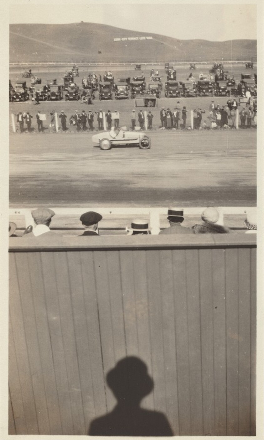 Untitled (Shadow of man watching car race)