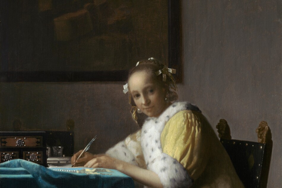 Shown from about the knees up, a pale, smooth-skinned woman in a fur-lined yellow jacket looks out at us as she sits writing at a table in this vertical painting. The woman’s body faces the table to our left. She turns her head to gaze at us from the corners of her dark gray eyes under faint brows. She has a wide nose, and her pale lips are closed. Her light brown hair is pulled back and held in place with white bows, and gleaming teardrop-shaped pearl earrings dangle from her ears. Her lemon-yellow jacket is trimmed with ermine fur, which is white with black speckles, at the cuffs and down the front opening. A full, elephant-gray skirt falls to the floor beneath the jacket. Both hands rest on the table, and she holds a quill in her right hand, farther from us, on a piece of paper. She leans forward in her wooden chair. The back panel of the chair is covered in black fabric and lined with brass studs. Two gilded finials, carved into lions’ heads, face the woman’s back with mouths open. The table is covered with a celestial-blue cloth crumpled near the left edge of the canvas. On the table are a strand of pearls, a pale yellow ribbon, and a black box with three brown panels studded with pearls around silver keyholes. Two pewter gray vessels are visible just beyond it, in front of a second chair, which faces us. On the putty-gray wall behind the woman, a framed painting hangs in the upper left quadrant of the composition. The painting-within-the painting is done in muted tones of brown and shows a cello and other unidentifiable objects.