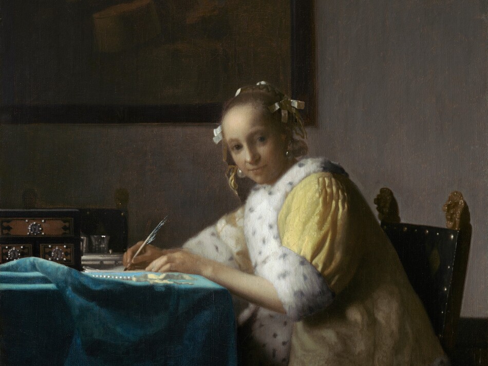 Shown from about the knees up, a pale, smooth-skinned woman in a fur-lined yellow jacket looks out at us as she sits writing at a table in this vertical painting. The woman’s body faces the table to our left. She turns her head to gaze at us from the corners of her dark gray eyes under faint brows. She has a wide nose, and her pale lips are closed. Her light brown hair is pulled back and held in place with white bows, and gleaming teardrop-shaped pearl earrings dangle from her ears. Her lemon-yellow jacket is trimmed with ermine fur, which is white with black speckles, at the cuffs and down the front opening. A full, elephant-gray skirt falls to the floor beneath the jacket. Both hands rest on the table, and she holds a quill in her right hand, farther from us, on a piece of paper. She leans forward in her wooden chair. The back panel of the chair is covered in black fabric and lined with brass studs. Two gilded finials, carved into lions’ heads, face the woman’s back with mouths open. The table is covered with a celestial-blue cloth crumpled near the left edge of the canvas. On the table are a strand of pearls, a pale yellow ribbon, and a black box with three brown panels studded with pearls around silver keyholes. Two pewter gray vessels are visible just beyond it, in front of a second chair, which faces us. On the putty-gray wall behind the woman, a framed painting hangs in the upper left quadrant of the composition. The painting-within-the painting is done in muted tones of brown and shows a cello and other unidentifiable objects.