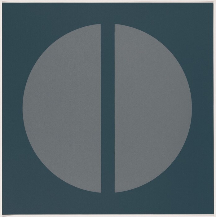 The image depicts a large circle bisected by a vertical line slightly off-center, creating an abstract design.