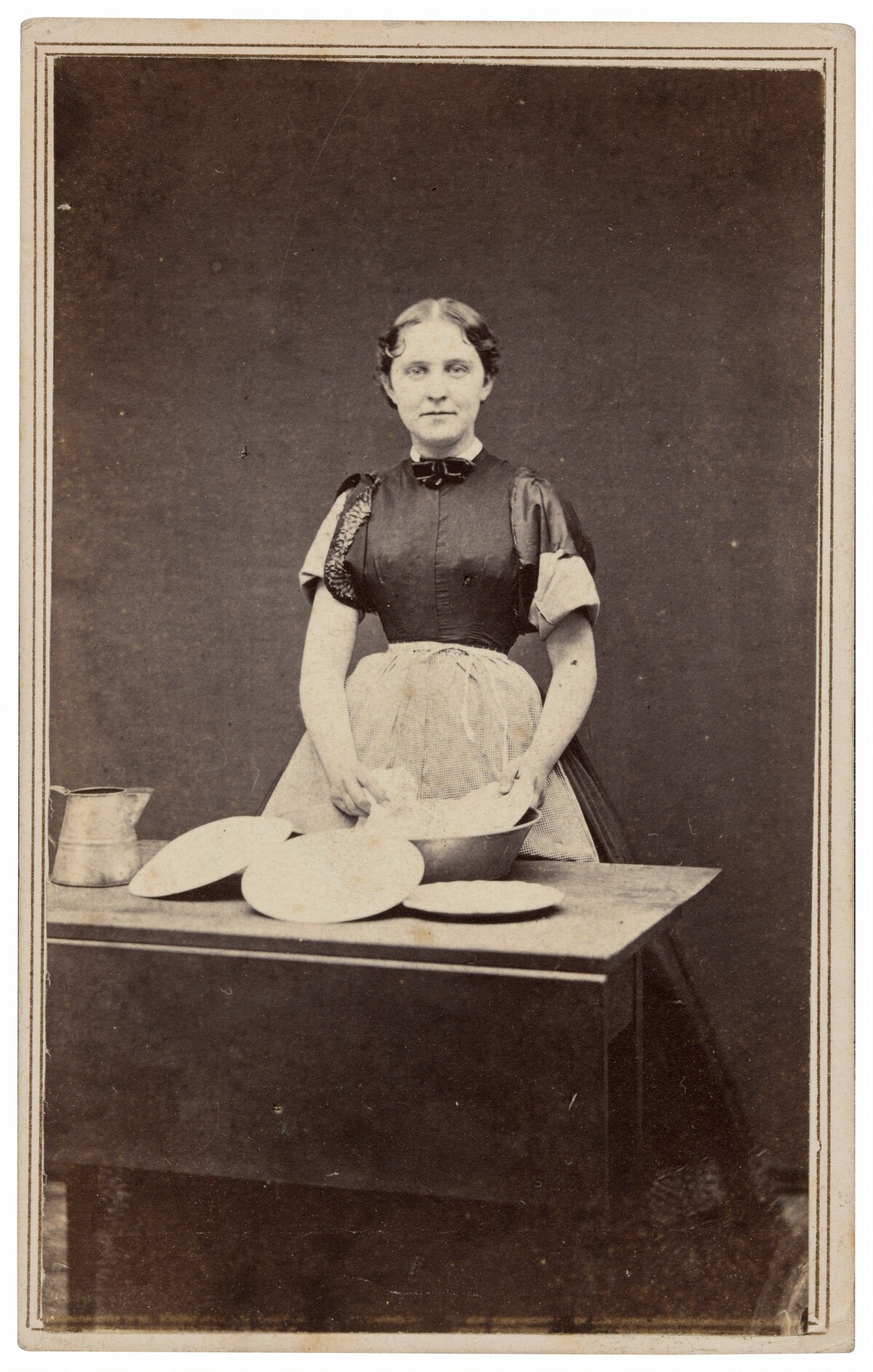 Portrait of a Woman Washing Dishes