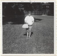 Untitled (Young woman with purse wearing dungarees), American 20th Century, August 1963