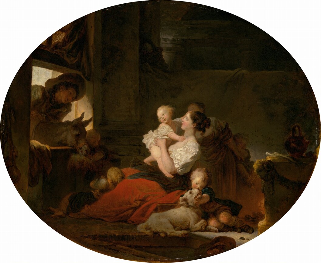 In a deeply shadowed room, two women and several children are gathered at the center of this wide, oval painting, looking toward a young man and donkey who peer in over a half-door to our left. The people all have light skin, and all of the children have blond hair. Light coming into the darkened room falls on a young woman holding a baby at the center of the composition. The woman sits facing our left in profile, looking at or toward the baby with brown eyes and parted lips. She has a long, straight nose, flushed cheeks, and her brown hair is pulled back into a bun at the back of her head. She wears a low-cut, ivory-white bodice with puffy sleeves, a black sash tied around her waist, and a voluminous crimson-red skirt. She props the baby so the child stands braced on chubby legs against her lap as the woman supports the torso and backside. One of the baby’s hands reaches for the woman’s neck and the other for her forehead as the head twists back to look to our left. The child wears a white garment. Two more children rest near the woman, with one leaning back against the woman’s shins and the other sitting with a white dog at the woman’s side, closer to us. Both children wear brown, white, and teal blue. Behind this group, another woman, seen mostly silhouetted against the shadows, reaches back and braces another child who seems to sit on a box or chest. The fifth and final child stands at the head of the donkey who peeks in over the half-door to our left. Above the donkey, a young, cleanshaven man wearing a wide-brimmed hat and baggy coat leans into the room and looks toward the central woman, a smile on his lips. His features are cast into shadow by the light coming in behind him but he has dark hair and dark eyes. The room beyond the women and children is draped with a gray cloth, as if hung over a low beam. The upper regions of the room are swallowed in shadow.