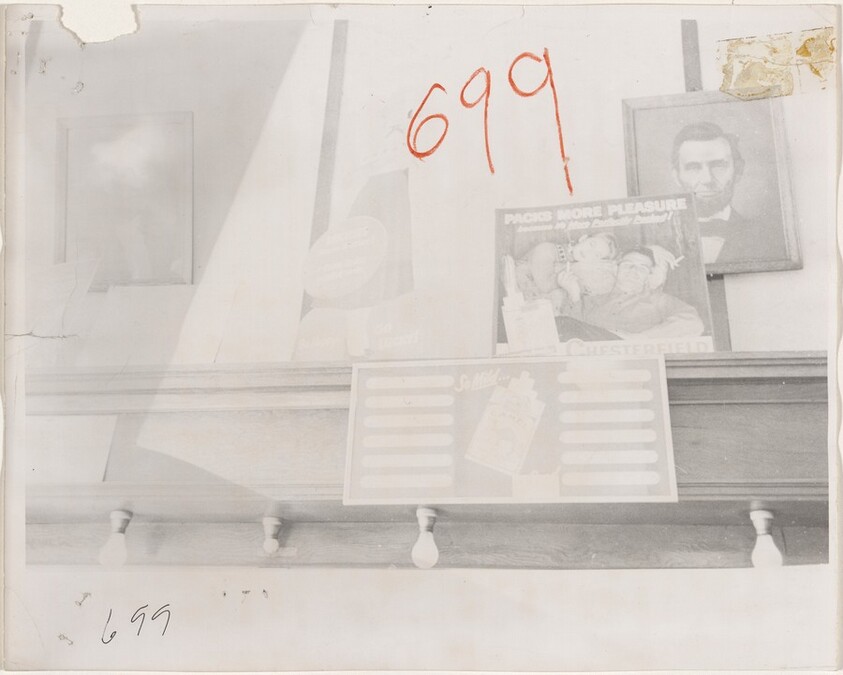 Wall with cigarette ads and presidential portraits--Butte, Montana