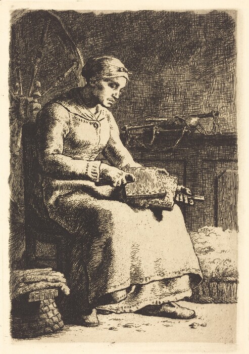 The image shows a woman seated with her full body visible. She is in a side view, leaning forward slightly, and focused on a task in her lap. Her facial features are detailed with a calm expression. She has her hair covered with a cloth tied around her head. The woman is wearing a long-sleeved dress with simple detailing. She is sitting in front of a spinning wheel with a stack of fabric or yarn at her feet. Her hands are working with a carding board, suggesting she is preparing fibers. The background features textured shading that suggests an indoor setting with a shelf holding several items.