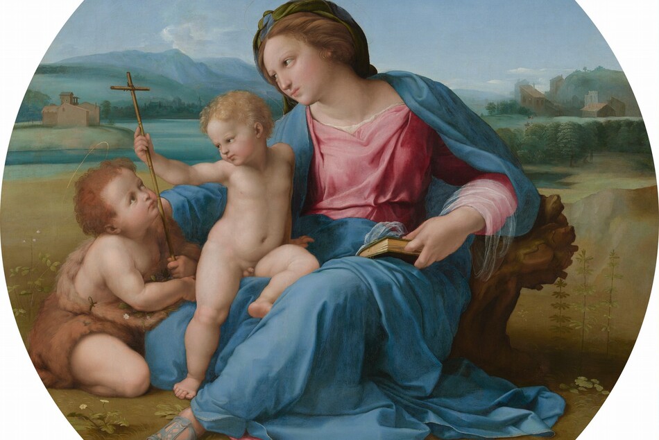 A woman and two children, all with pale skin and flushed cheeks, sit together in a landscape in this round painting. The woman takes up most of the composition as she sits with her right leg, to our left, tucked under her body. Her other leg, on our right, is bent so the foot rests on the ground, and that knee angles up and out to the side. She wears a rose-pink dress under a topaz-blue robe, and a finger between the pages of a closed book holds her place. Her brown hair is twisted away from her face. She has delicate features and her pink lips are closed. She looks and leans to our left around a nude young boy who half-sits and half-stands against her bent leg. The boy has blond hair and pudgy, toddler-like cheeks and body. The boy reaches his right hand, on our left, to grasp the tall, thin cross held by the second young boy, who sits on the ground next to the pair. This second boy has darker brown hair and wears a garment resembling animal fur. The boy kneels facing the woman and looks up at her and the blond boy. The trio sits on a flat, grassy area in front of a body of water painted light turquoise. Mountains in the deep distance are pale azure blue beneath a nearly clear blue sky.