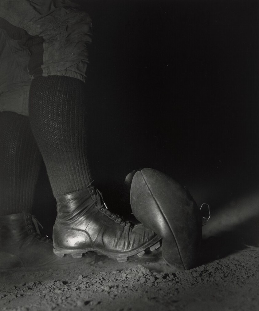 Wes Fesler Kicking a Football