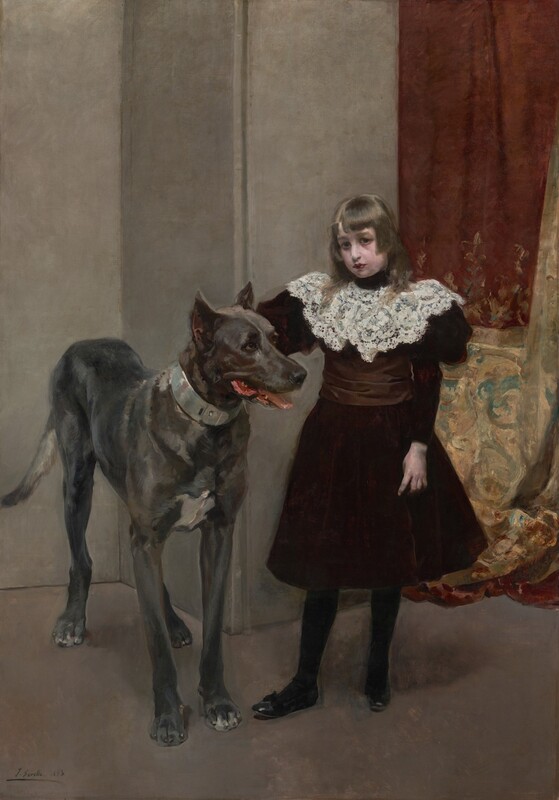 This painting shows a young girl standing beside a large dog. The girl has a fair complexion and straight brown hair that falls on her shoulders. She is wearing a dark burgundy dress with a white lace collar, black stockings, and shoes. She looks directly at us. The dog to the left reaches almost to her shoulder and has a light gray coat. Its mouth is slightly open, revealing a pink tongue and the tips of white teeth. The background is mostly plain gray walls, but on the right side there is elegant drapery in shades of deep red and gold with intricate teal designs.