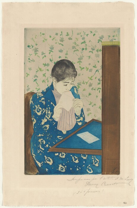 We look slightly down onto a young woman sitting at a writing desk as she licks an envelope in this vertical, color print. A table folds down or extends from a tall secretary desk to our right. The blotter on the table and the woman’s long dress are both royal blue. The dress has a vaguely floral pattern in the cream-white of the paper, and the jacket is open to reveal a vertically pleated, beige-pink shirt beneath. The woman’s skin is also the color of the paper. Her black hair is pulled back over dark brows and a delicate nose. She holds the open flap of the envelope to her mouth with both hands. A piece of white paper lies on the desktop in front of her. She sits in a brown chair, and the wallpaper of the room is patterned with green leaves against a white background. The sheet is inscribed with graphite across the right half of the bottom margin, “Imprimée par l’artiste et M. Leroy Mary Cassatt (25 épreuves)."