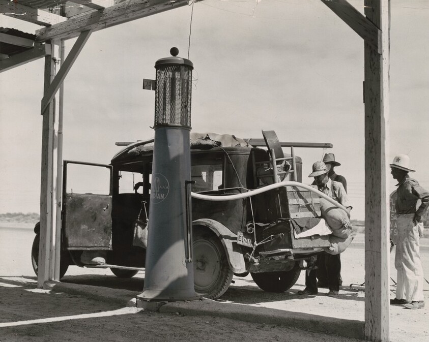 Family of nine from near Fort Smith, Arkansas, on their way to find work in the California harvest, between Yuma and Phoenix, Arizona