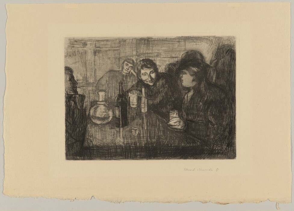 The image shows several individuals sitting around a table in a dimly lit setting. They are shown from the waist up, engaging in conversation. One man is leaning on the table, while another person next to him is talking to someone across from them. The woman across from them has her hair tied back and is holding a drink. The table is filled with bottles and glassware, indicating a social gathering. The background features shadowy figures and unidentifiable structures, adding to the intimate ambiance of the scene.