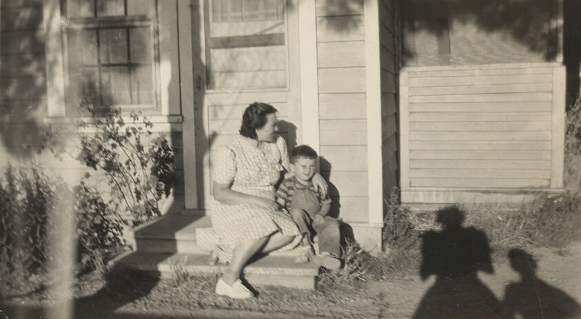Untitled (Mother and son on porch)