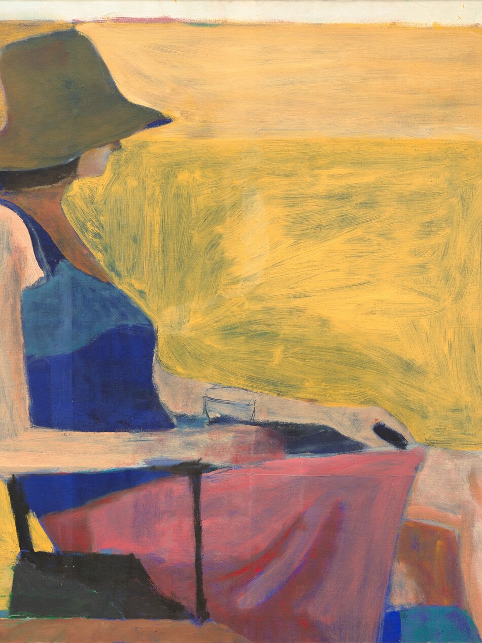 A woman with peach-colored skin wearing a floppy hat covering most of her face, a sleeveless shirt, and a skirt sits facing our right in profile against a background of vivid pineapple yellow streaked with olive green in this nearly square painting. The scene is loosely painted with broad, visible brushstrokes throughout, especially in the yellow background. The woman’s brimmed, dark taupe hat comes down to her pointed nose. Her lips seem closed and a band of brown suggests chin-length hair. She leans back in the chair and rests her arms along its thin, black arms. She holds a glass in her right hand, closer to us. Her tank top is cobalt blue and her skirt, which comes almost to her knees, is carnation pink. Her left leg is crossed over her right, and her ankles and feet are cropped by the bottom edge of the canvas. The yellow background behind her has royal-blue lines near the edges of the canvas to the left and right.