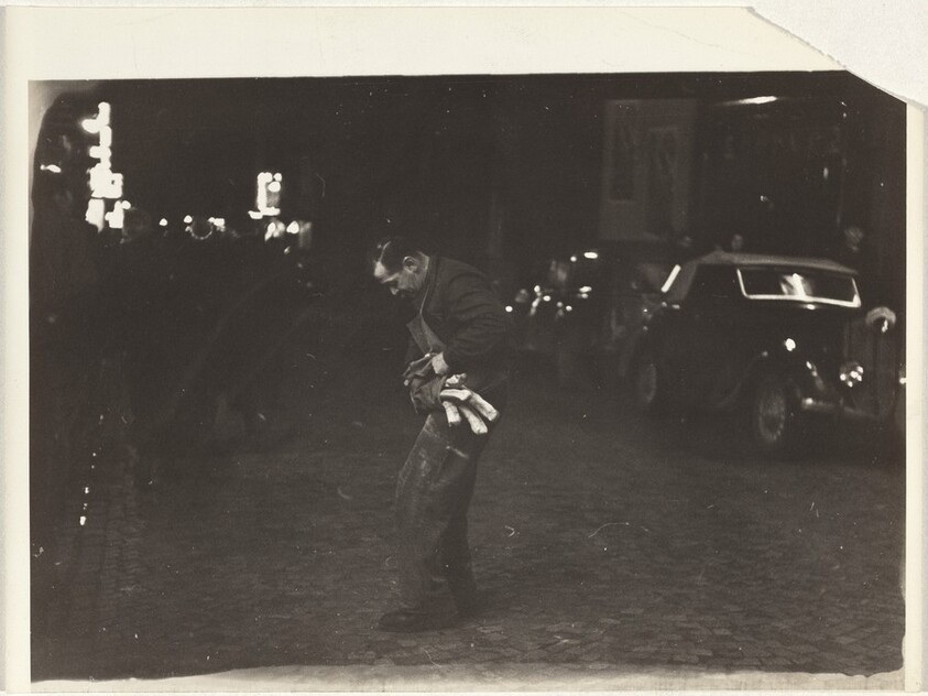 Man with baguettes in street, Paris