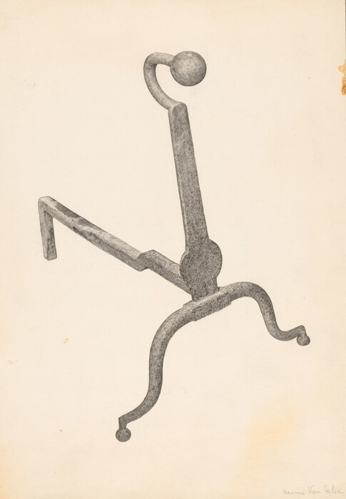 The image shows a large metallic object that is an ornate andiron with a hooked top and curved legs. It is centered against a plain, light-colored background. The object is mostly grey with a textured appearance. The andiron stands upright with its top curving slightly to the right and its legs extending in opposite directions at the bottom.