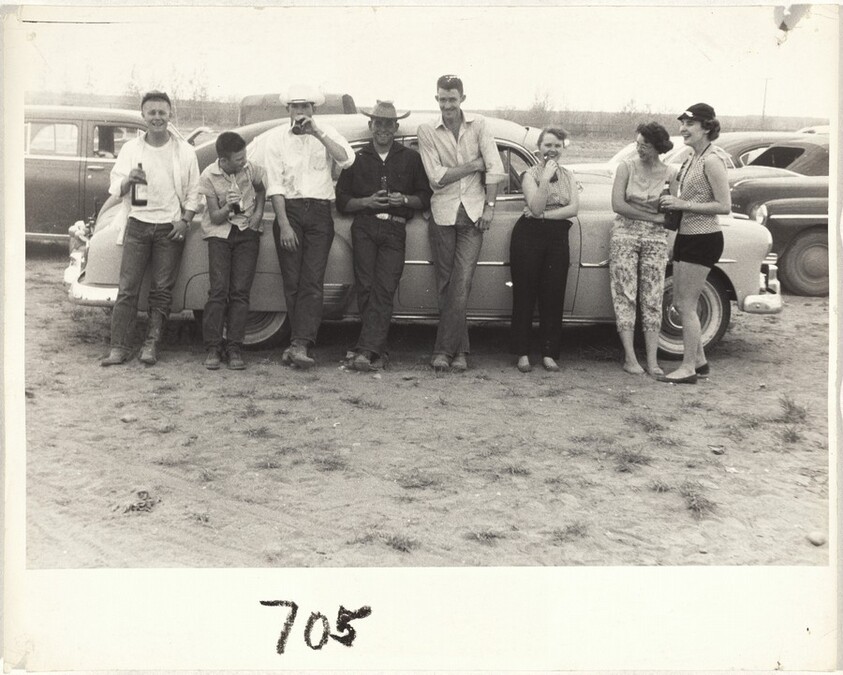Group leaning on automobile--Casper, Wyoming