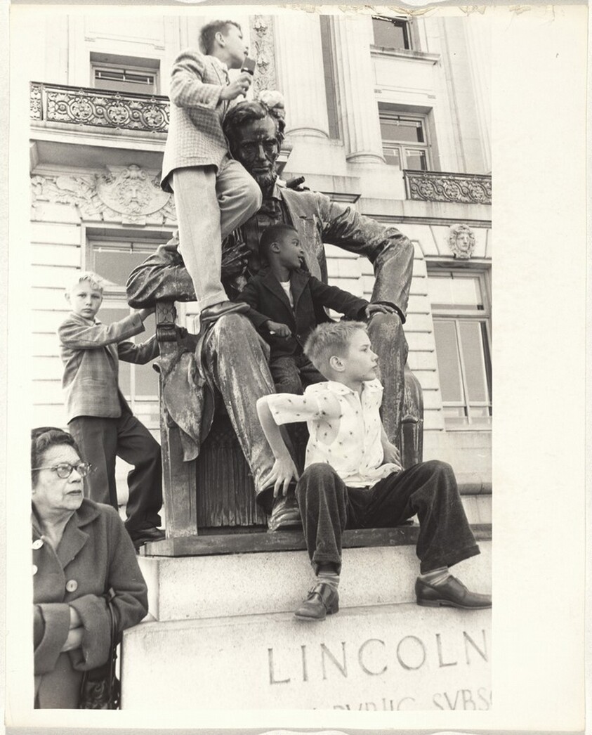 Children on Lincoln statue, parade--San Francisco